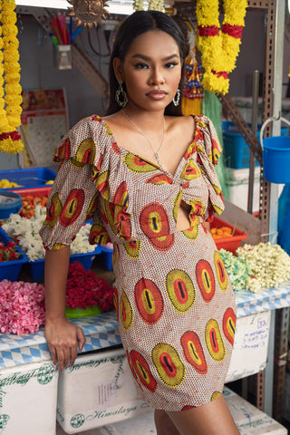 Zalika Mini Dress with Sweetheart Neckline and Twist Detail - Yellow and Orange Rhythmic Spirits Print | ILC OA OG